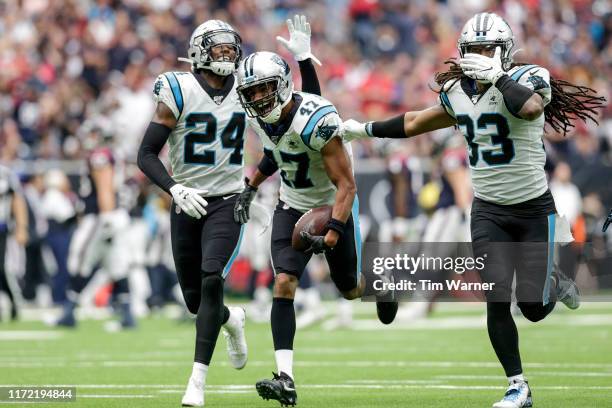 Ross Cockrell of the Carolina Panthers celebrates with teammates after an interception in the second quarter against the Houston Texans at NRG...