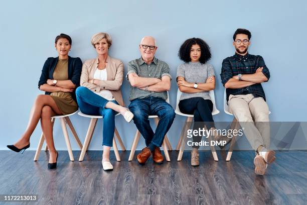 patiently waiting on our time to shine - people sitting in a row stock pictures, royalty-free photos & images