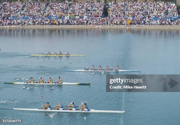 James Cracknell, Steve Redgrave, Tim Foster and Matthew Pinsent of Great Britain cross the finish line to win gold ahead of Italy and Australia in...