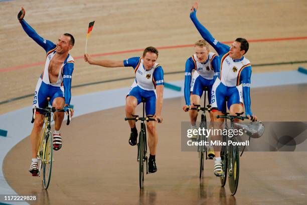 Guido Fulst, Robert Bartko,Daniel Becke and Jens Lehmann of Germany celebrate winning the gold medal in the Men's Team Pursuit on 18th September 2000...