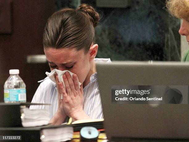 Casey Anthony cries while her brother Lee Anthony testifies in her murder trial at the Orange County Courthouse in Orlando, Florida, Friday, June 24,...