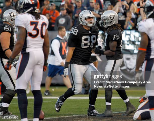 Oakland Raiders tight end Nick Kasa celebrates his touchdown with Oakland Raiders wide receiver Denarius Moore during the fourth quarter of their...