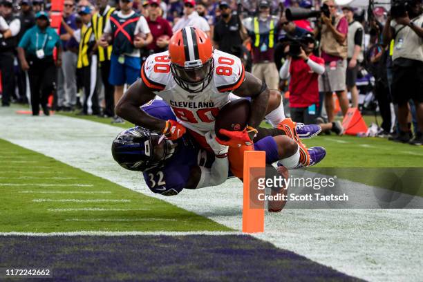 Jarvis Landry of the Cleveland Browns dives for the end zone as DeShon Elliott of the Baltimore Ravens defends during the second half at M&T Bank...