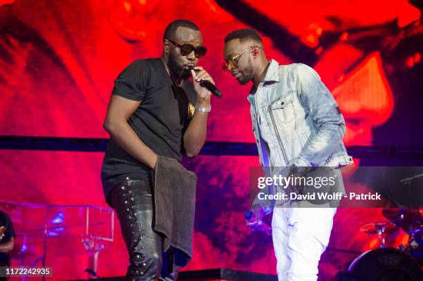 Gims and Dadju perform at Stade de France on September 28, 2019 in Paris, France.