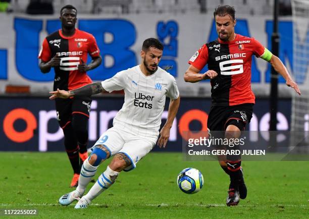Marseille's Argentinian forward Dario Ismael Benedetto vies with Rennes' French defender Damien Da Silva during the French L1 football match between...