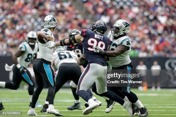 Watt of the Houston Texans strips the ball from Kyle Allen of the Carolina Panthers in the third quarter at NRG Stadium on September 29, 2019 in...