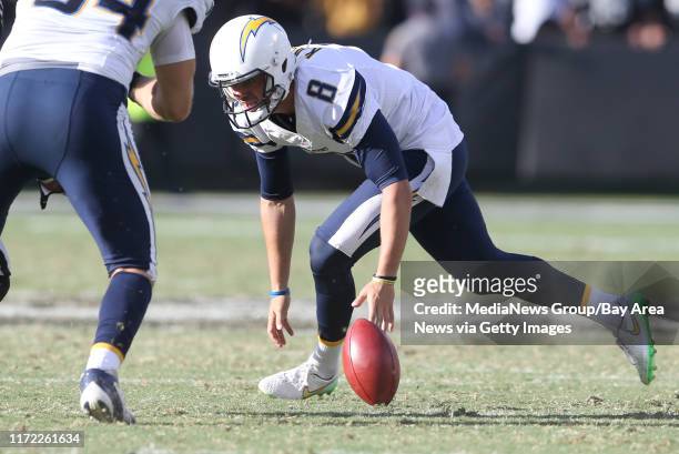 San Diego Chargers placeholder Drew Kaser chases after a bad snap in the fourth quarter of their NFL game against the Oakland Raiders at the Coliseum...