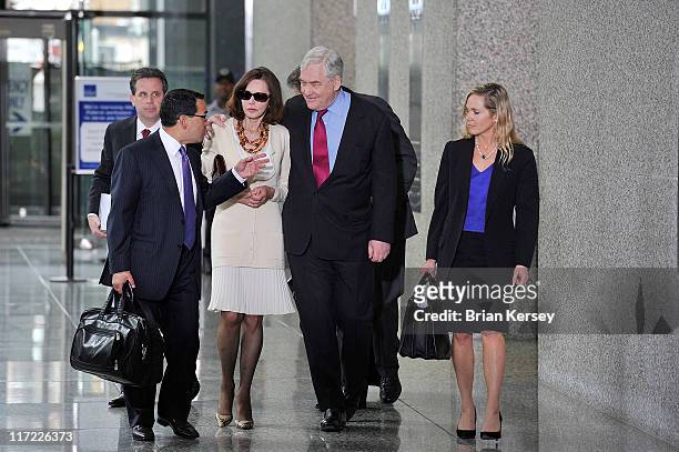 Former press magnate Conrad Black , his wife Barbara Amiel and his legal team leave federal court where he was resentenced to 3 1/2 years in prison...
