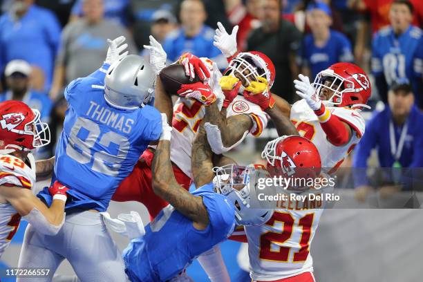 Jordan Lucas of the Kansas City Chiefs battles for the Hail Mary in the fourth quarter against Logan Thomas and Kenny Golladay of the Detroit Lions...