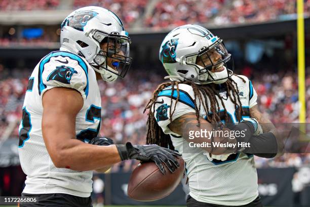 Eric Reid and Tre Boston of the Carolina Panthers celebrate after a fumble recovery during a game against the Houston Texans at NRG Stadium on...