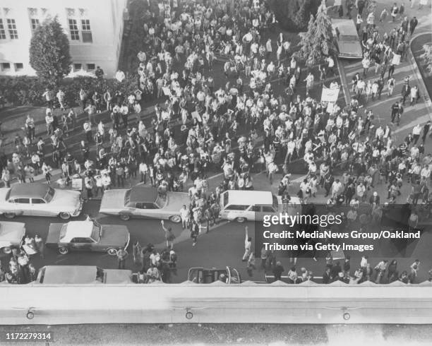 Oakland, CA 8 April 1968 - A crowd charges the Alameda County Courthouse during a Black Panther Party and Peace and Freedom sponsored march.
