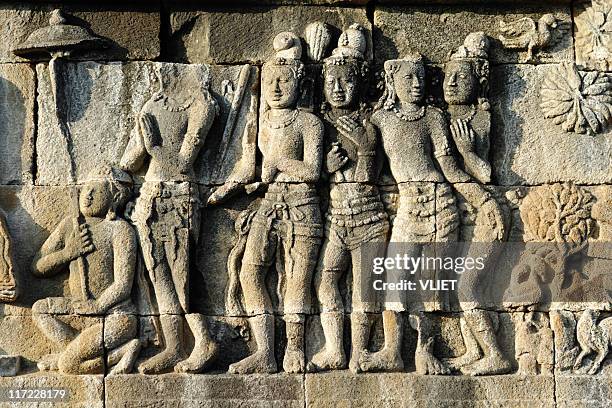 stone carvings of borobudur temple in indonesia - borobudur temple stock pictures, royalty-free photos & images