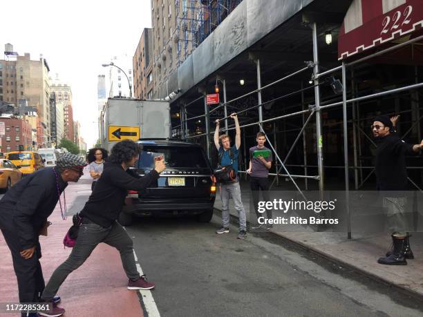 American film director Spike Lee and his crew film Rap musician and producer Q-Tip for a scene in front of the Chelsea Hotel , New York, New York,...