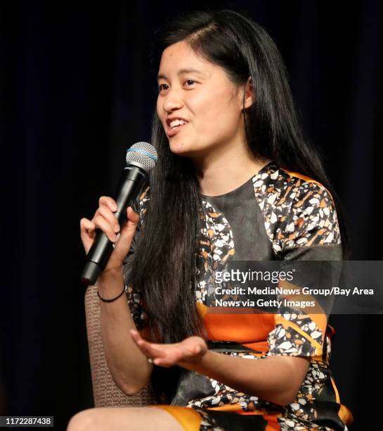 And Founder Julia Hu of Lark speaks during a panel discussion at the Silicon Valley Leadership Group annual luncheon at the Santa Clara Convention...