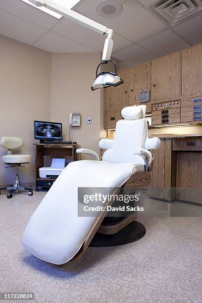 dental office chair and dental equipment. - tandartsstoel stockfoto's en -beelden