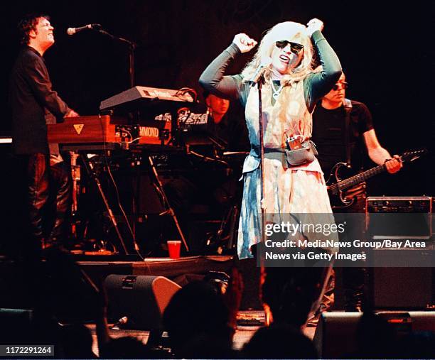 John J. Kim-staff 5/30/99 ang que Singer Debbie Harry grooves to the music of Blondie Sunday night at the Warfield in San Francisco.