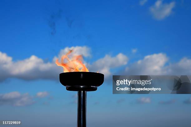 glory burning torch - the olympic games stock pictures, royalty-free photos & images