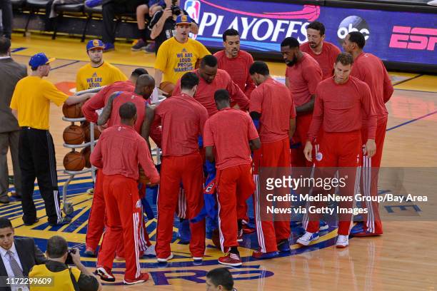Los Angeles Clippers remove their warm up jackets and wear their shirts inside-out as a sign of protest over the alleged racist remarks made by their...