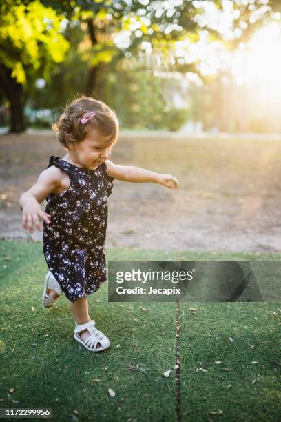 cute little girl in park - girl sandals stock pictures, royalty-free photos & images