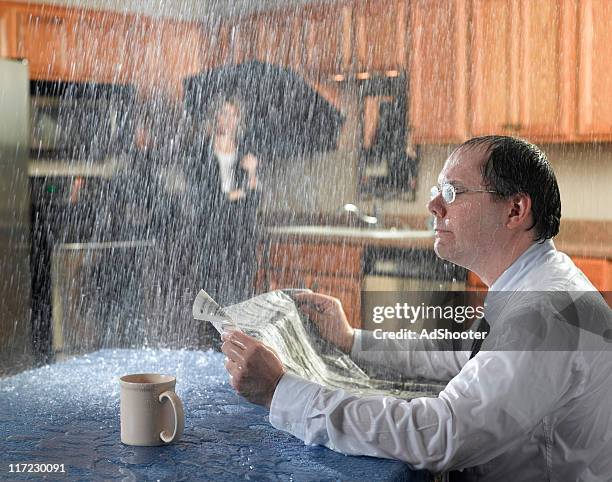 leaking roof - humor stockfoto's en -beelden