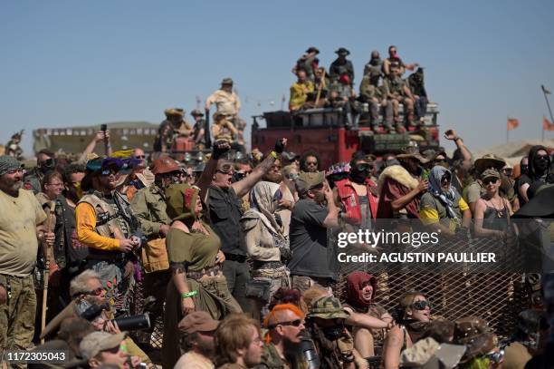 Festival goers watch a swimsuit contest during Wasteland Weekend festival at the Mojave desert in Edwards, California on September 28, 2019. - In...