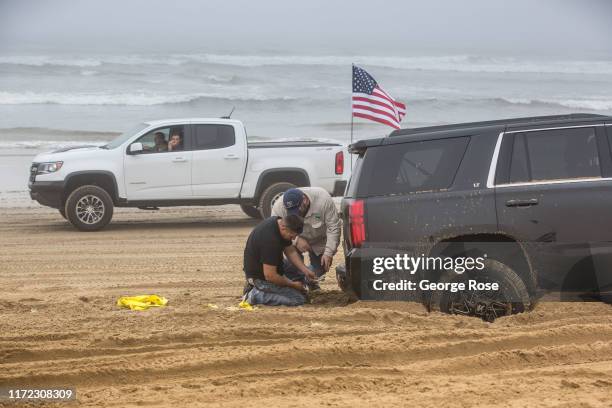 Thousands of campers jam the sandy beach at Oceano Dunes State Vehicular Area under a thick Labor Day Weekend fog on August 31 near Pismo Beach,...