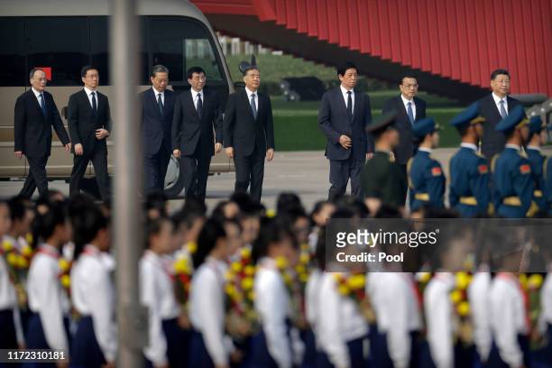 Chinese President Xi Jinping, right, and members of the Politburo Standing Committee, from left, Wang Qishan, Han Zheng, Zhao Leji, Wang Huning, Wang...