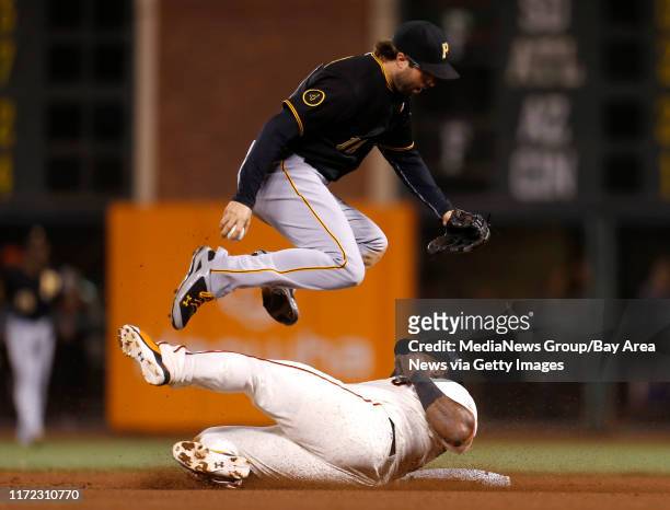 San Francisco Giants' Pablo Sandoval breaks up a potential double play after being thrown out at second base against Pittsburgh Pirates' Neil Walker...