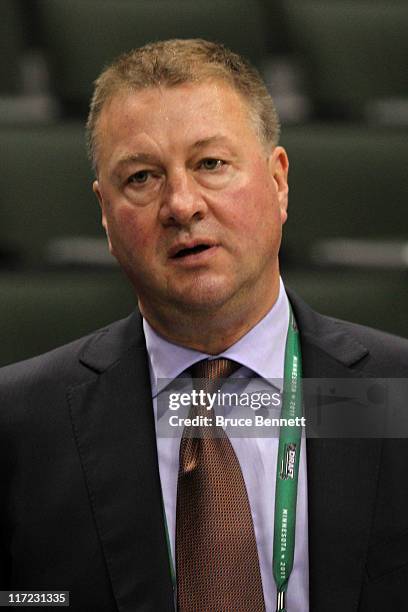 General manager Mike Gillis of the Vancouver Canucks looks on before day one of the 2011 NHL Entry Draft at Xcel Energy Center on June 24, 2011 in St...