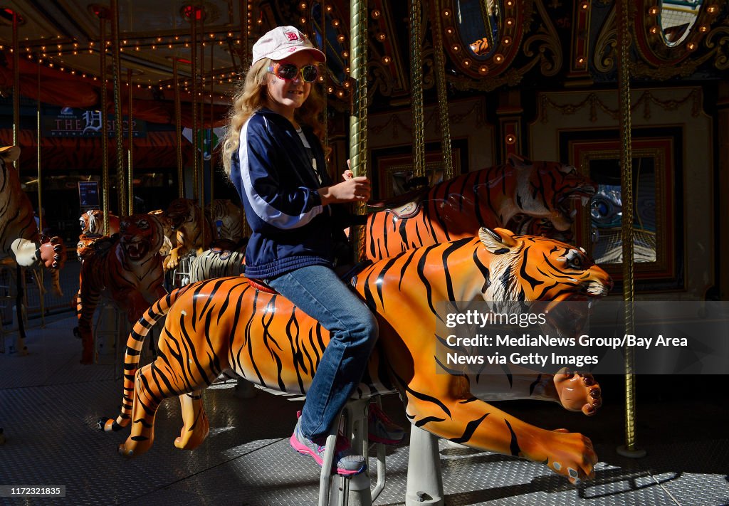 Hannah Julien of Kalamazoo, Mich., rides the Tiger Carousel before News  Photo - Getty Images