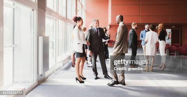 business people standing in the conference room - lobbying stock pictures, royalty-free photos & images