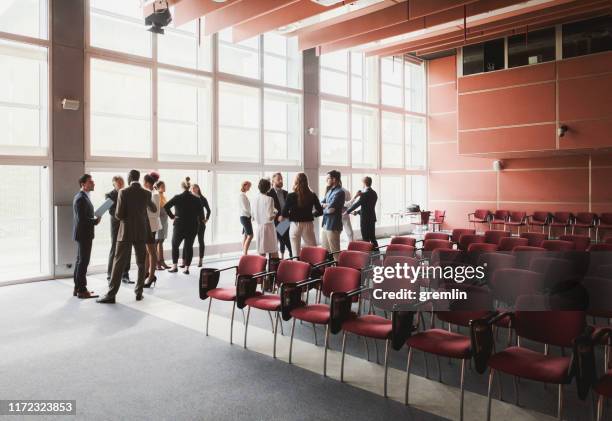 group of business people in the convention center - large conference event stock pictures, royalty-free photos & images