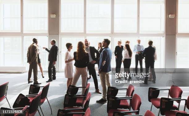 group of business people in the convention center - wide stock pictures, royalty-free photos & images