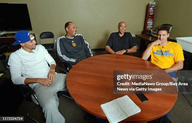 From left, Golden State Warriors player Stephen Curry and his father Dell Curry, sits with Mychal Thompson and Golden State Warriors player Klay...