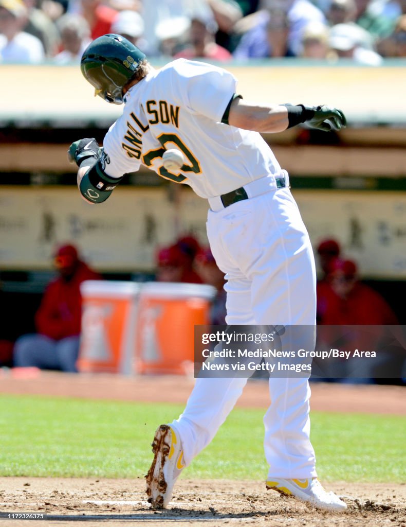 Oakland Athletics' Josh Donaldson gets hit by a pitch from Los News  Photo - Getty Images