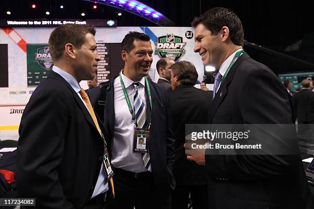 Doug Weight of the New York Islanders, Bill Guerin of the Pittsburgh Penguins and Scott Lachance of the New Jersey Devils look on during day one of...