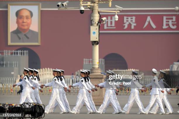 Cadets from China's People's Liberation Army Navy march in formation before a ceremony to mark Martyr's Day at Tiananmen Square in Beijing, Monday,...