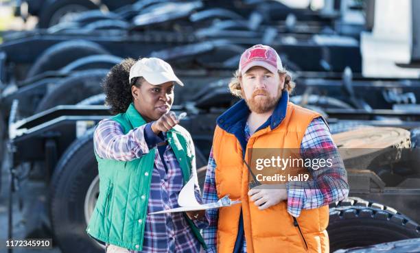 workers at trucking company - trucker hat stock pictures, royalty-free photos & images