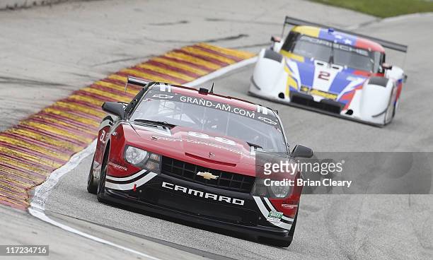 The Camaro of Jordan Taylor and Bill Lester leads during practice for the Road America 250 at Road America on June 24, 2011 in Elkhart Lake,...