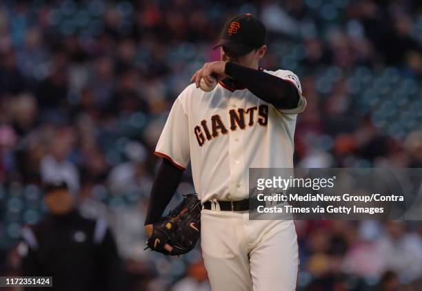 San Francisco Giants pitcher Noah Lowry, #51, wipes his face while pitching against the Arizona Diamondbacks in the 2nd inning of their game on...