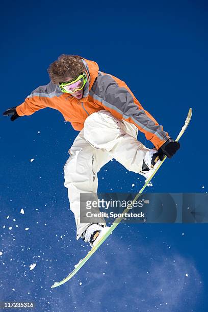 snowboarder in the air - snowboard jump close up stock pictures, royalty-free photos & images