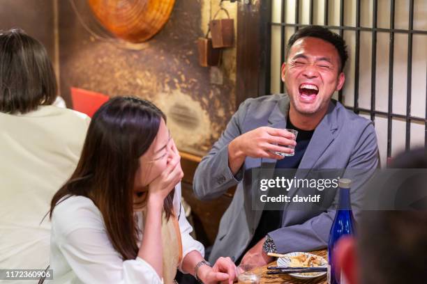 drunk japanese businessman in a restaurant - izakaya stock pictures, royalty-free photos & images