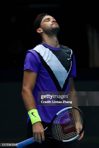 Grigor Dimitrov of Bulgaria reacts during the Men's singles first round match against Andrey Rublev of Russia of 2019 China Open at the China...