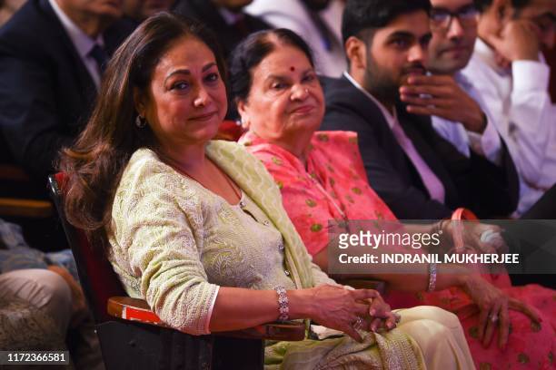 Tina Ambani and Kokilaben , wife and mother of Indian tycoon Anil Ambani attend the annual general meeting of Reliance ADAG Companies in Mumbai on...