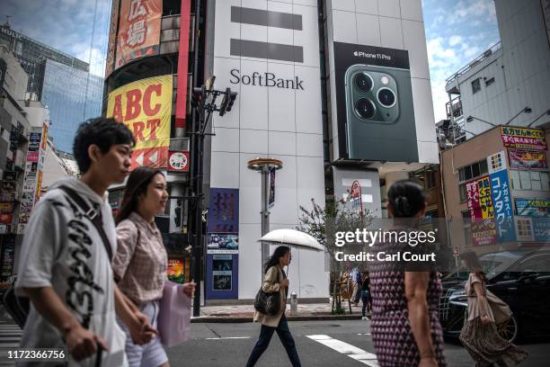 People walk past a SoftBank mobile phone store on September 30, 2019 in Tokyo, Japan. SoftBank, the technology and investment conglomerate owned by...