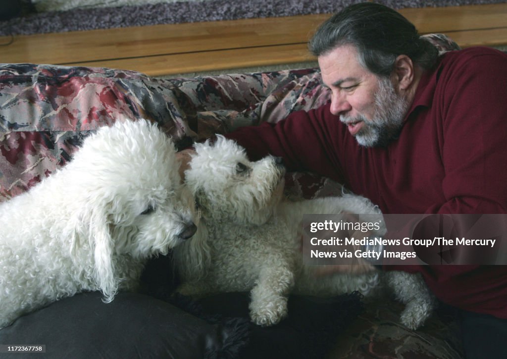 Steve Wozniak plays with his two dogs, Z and Bennie.  They are the Bichon Frise breed.  Wozniak, co-founder of Apple Computer, lives in Los Gatos and has four dogs, lots of Segways and a few Hummers. Today is Wednesday, March 15, 2006. (Karen T. Borchers/