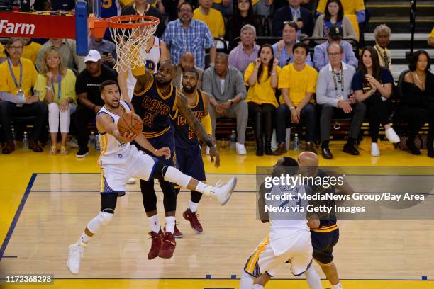 Golden State Warriors' Stephen Curry goes for a basket past Cleveland Cavaliers' LeBron James during the third quarter of Game 1 of the NBA Finals at...