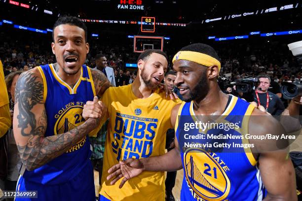 Golden State Warriors' Matt Barnes , Golden State Warriors' Stephen Curry and Golden State Warriors' Ian Clark celebrate winning Game 4 of the NBA...