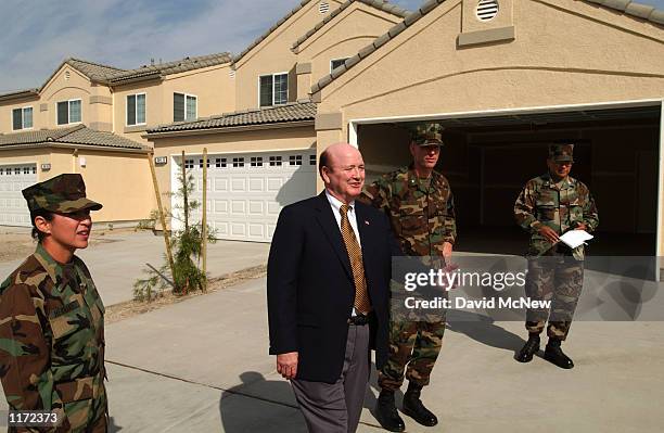 Assistant Secretary of the Navy H.T. Johnson tours modern tract homes under construction for US Marine families in the Deluz area, October 30, 2001...