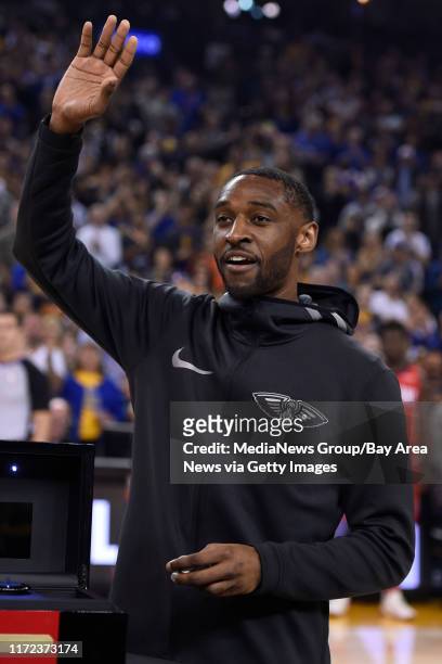 Former Golden State Warriors player Ian Clark, who now plays for the New Orleans Pelicans, receives his championship ring during a pregame ceremony...